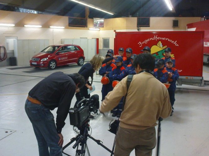 Zusammenrücken vor der Kamera zum Gruppenbild